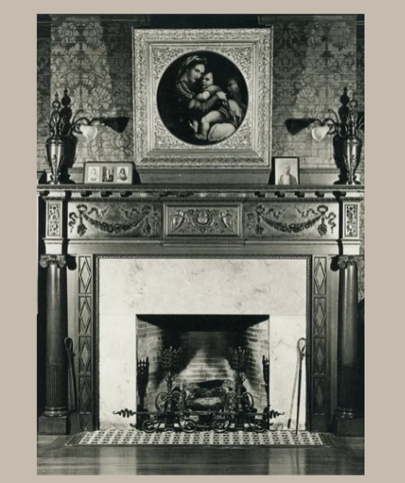 Fireplace with artwork hanging above mantel