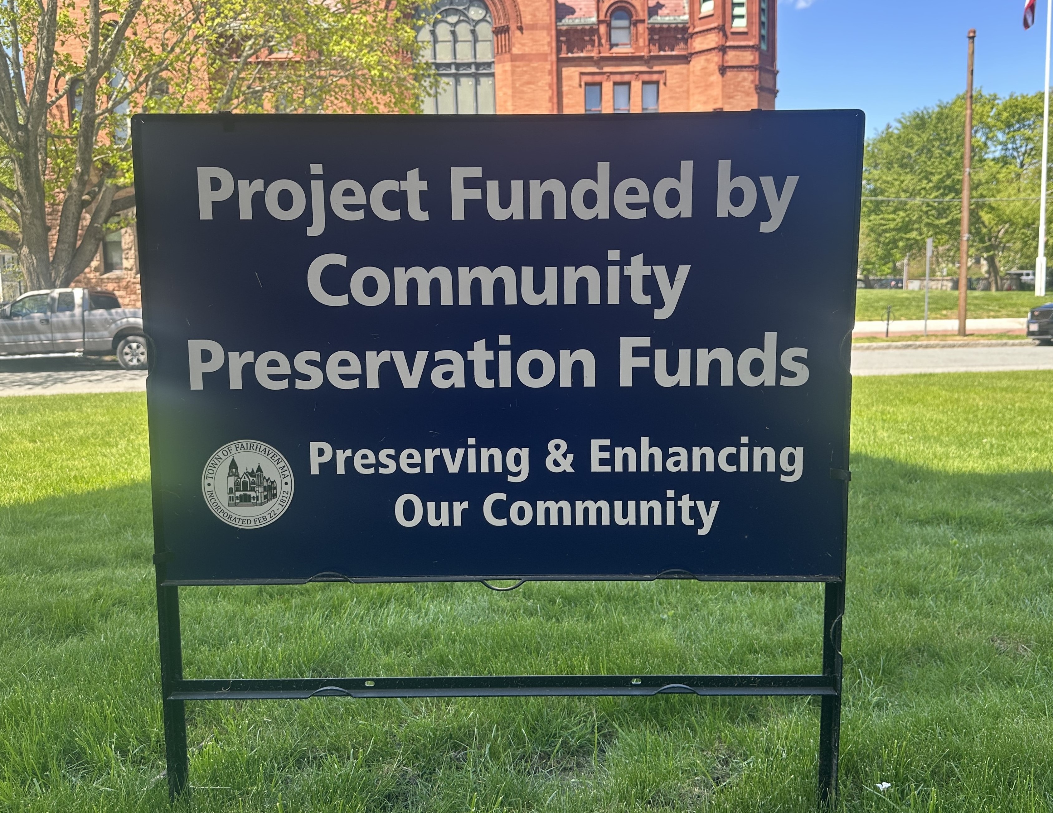 Lawn sign reading Project Funded by Community Preservation Funds. Preserving and Enhancing Our Community