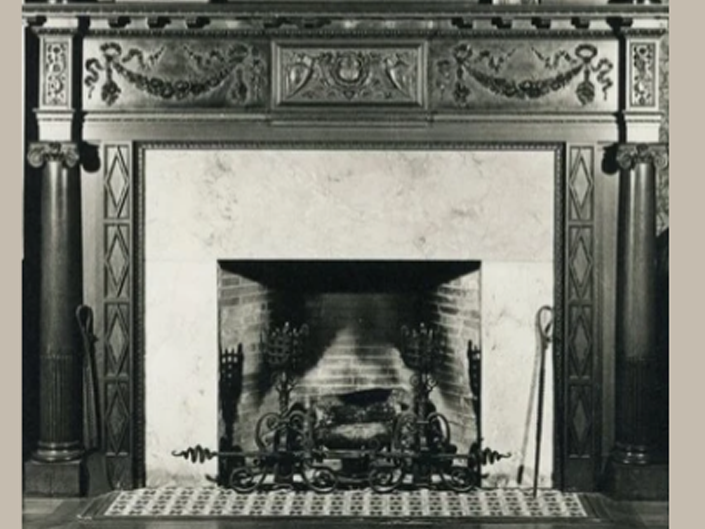Fireplace with artwork hanging above mantel